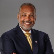 black man in yellow tie