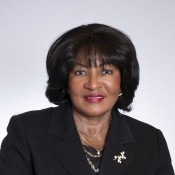 black women smiling in black jacket