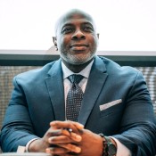 Black man hands folded